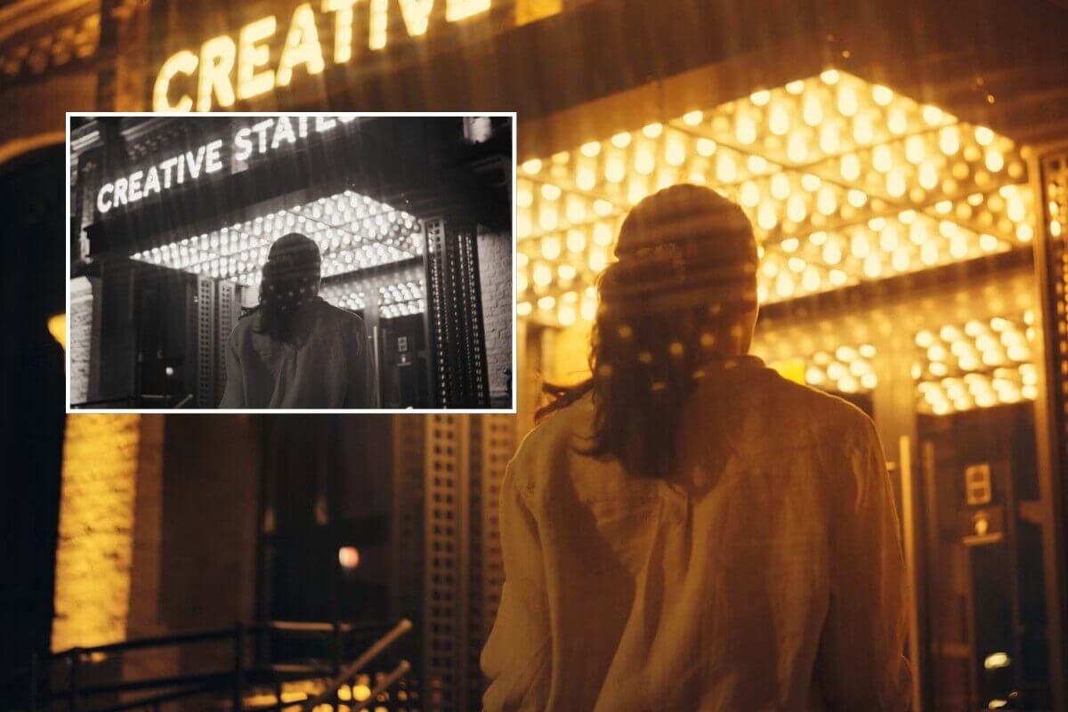 白黒の映画クリップを色付きで高画質な動画に変換し、女性の背中を映す